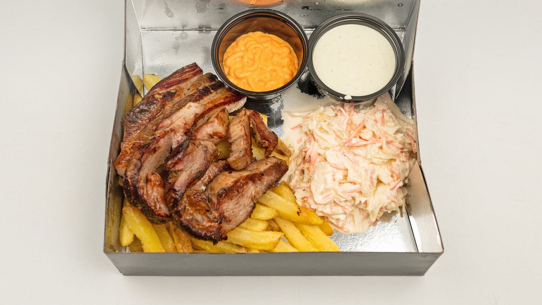 Smoked pork shoulder, bondiola style, sliced over fries with coleslaw and house sauces